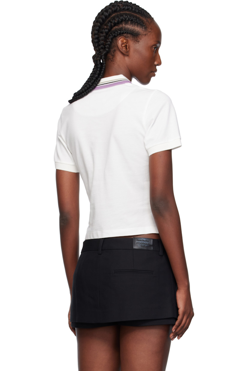 Organic cotton piqué polo.

· Striped rib-knit spread collar and cuffs
· Two-button placket 
· Embroidered logo at chest
· Cropped tennis-tail hem 

Supplier color: White
