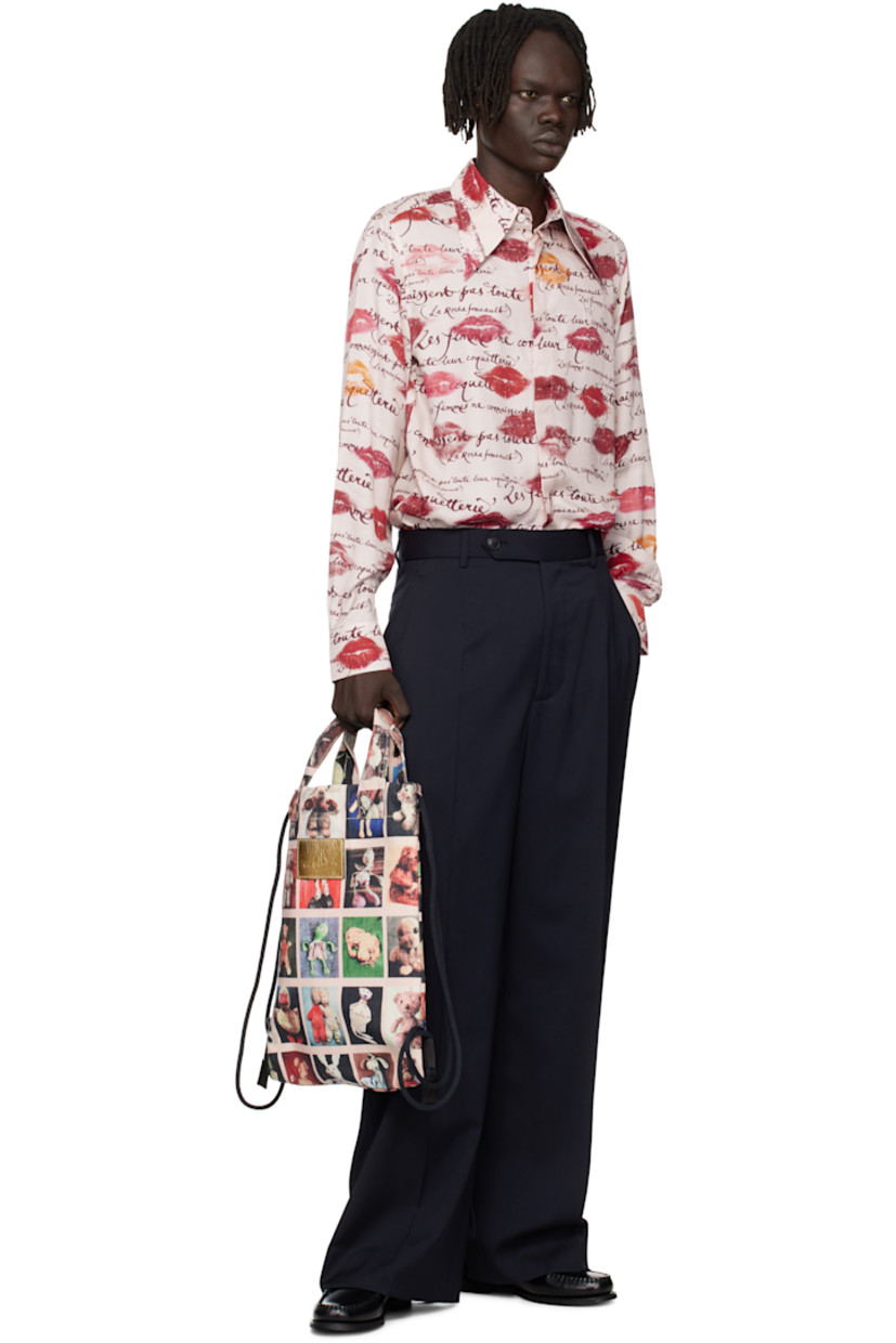 Viscose twill shirt. 

· Graphics and text printed throughout
· Pointed collar
· Button closure 
· Logo embroidered at chest
· Shirttail hem
· Single-button barrel cuffs
· Twin pleats at back yoke
· Mother-of-pearl hardware

Supplier color: Kisses