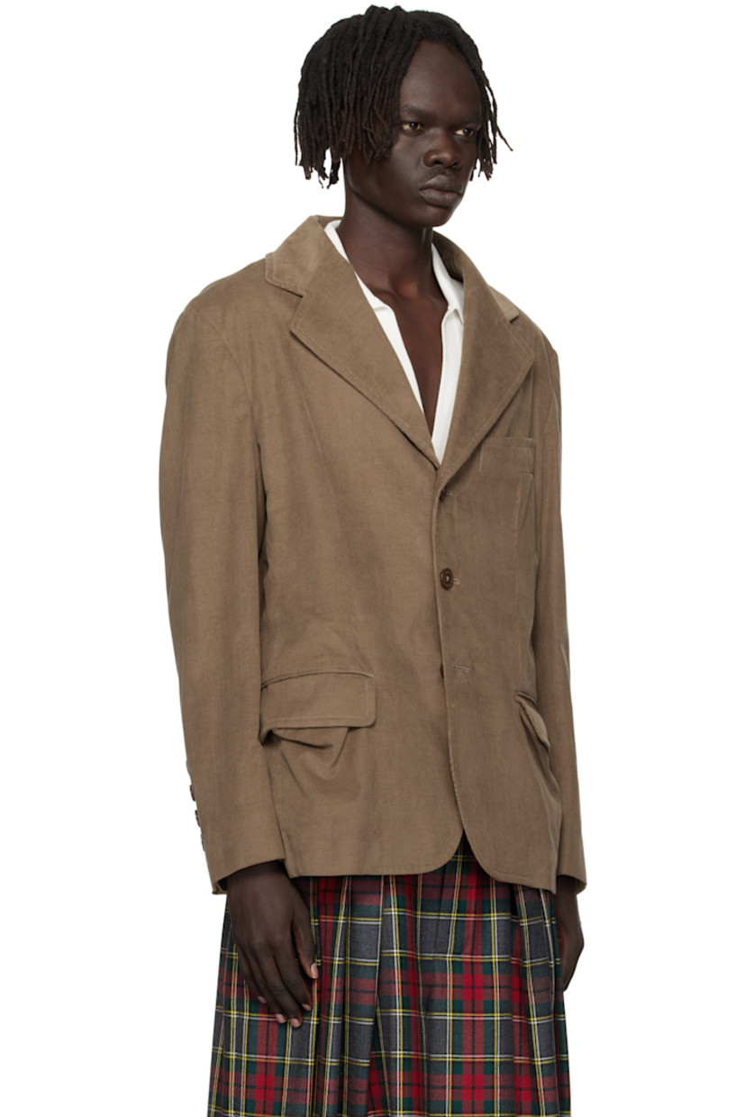 Organic cotton corduroy blazer. 

· Notched lapel
· Button closure
· Welt pocket and flap pockets 
· Four-button surgeon's cuffs
· Twin vents at back hem 
· Welt pocket at interior
· Fully lined

Supplier color: Tobacco