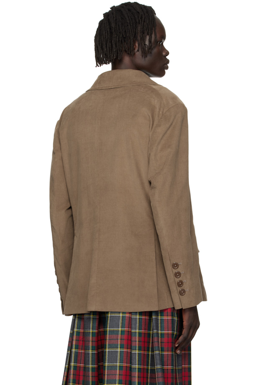 Organic cotton corduroy blazer. 

· Notched lapel
· Button closure
· Welt pocket and flap pockets 
· Four-button surgeon's cuffs
· Twin vents at back hem 
· Welt pocket at interior
· Fully lined

Supplier color: Tobacco