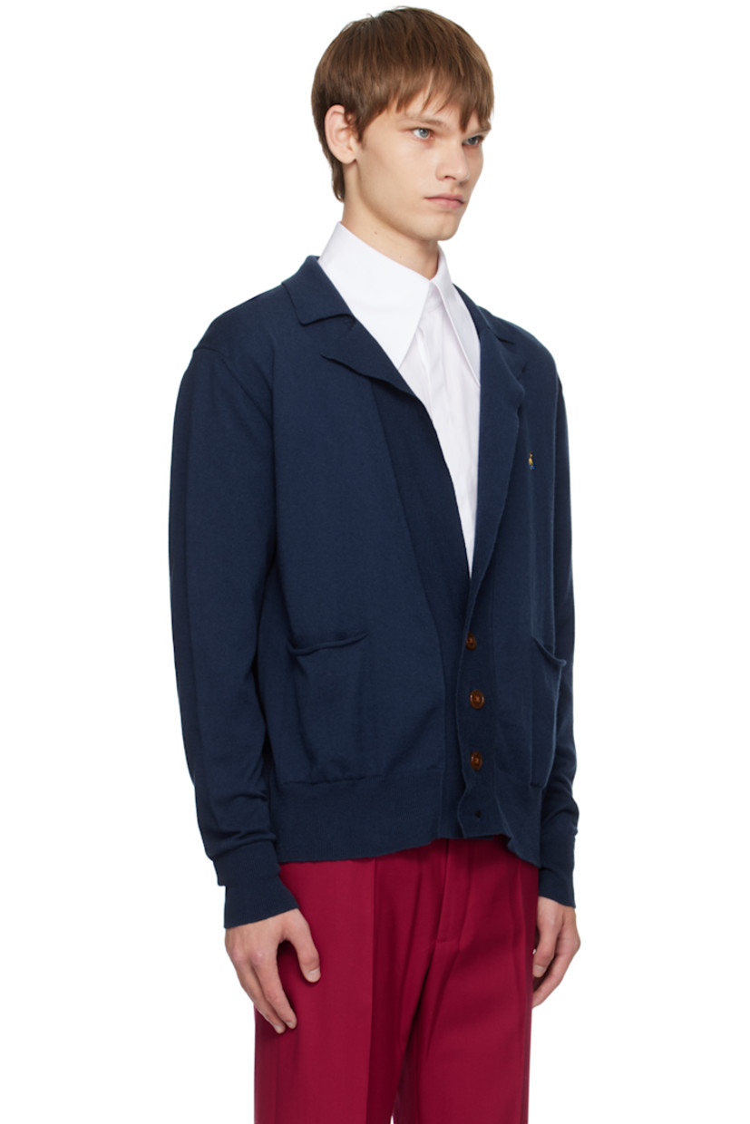 Knit organic cotton- and cashmere-blend cardigan.

· Rib-knit open spread collar, hem, and cuffs
· Button closure
· Logo embroidered at chest
· Welt pockets with rolled edge at front

Supplier color: Navy