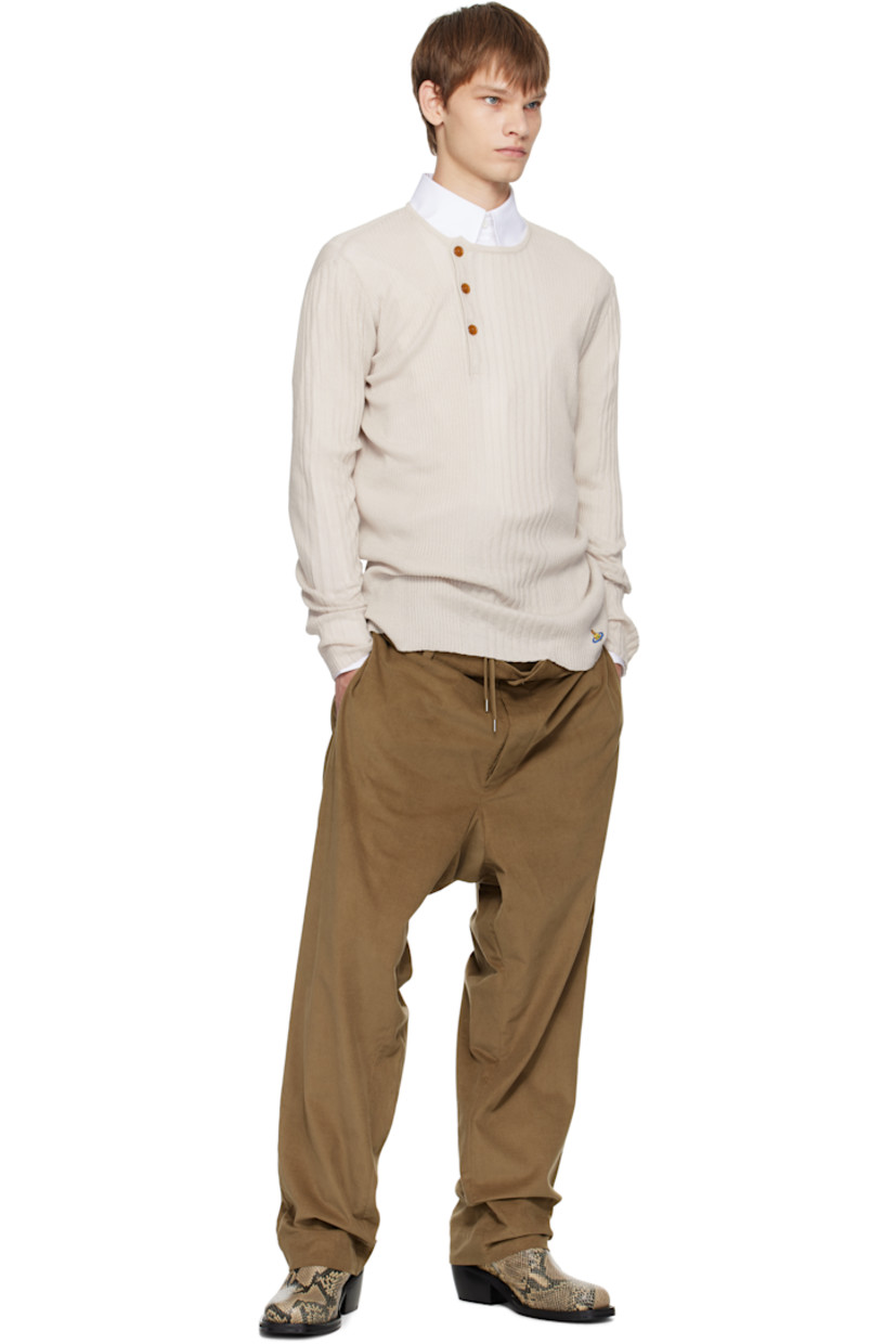Rib-knit organic cotton- and cashmere-blend henley.

· Crewneck
· Offset three-button placket
· Logo embroidered at front hem

Supplier color: Dusty white