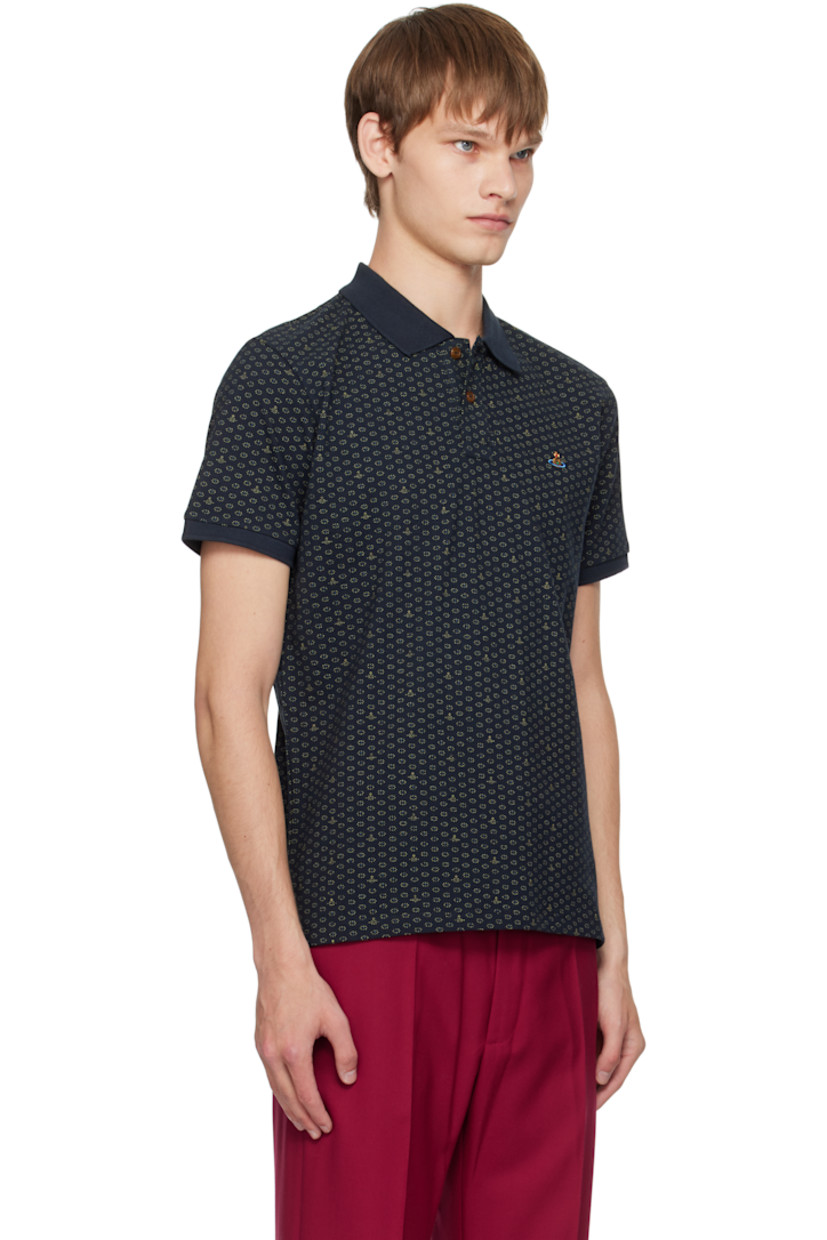 Organic cotton piqué polo.

· Logo graphic polka-dot pattern printed throughout
· Spread collar
· Two-button placket
· Logo embroidered at chest
· Tennis-tail hem
· Rib-knit cuffs

Supplier color: Dots & orbs