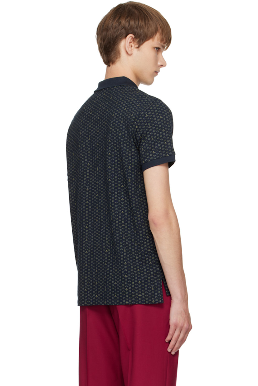 Organic cotton piqué polo.

· Logo graphic polka-dot pattern printed throughout
· Spread collar
· Two-button placket
· Logo embroidered at chest
· Tennis-tail hem
· Rib-knit cuffs

Supplier color: Dots & orbs