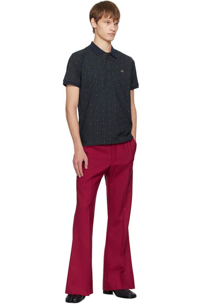 Organic cotton piqué polo.

· Logo graphic polka-dot pattern printed throughout
· Spread collar
· Two-button placket
· Logo embroidered at chest
· Tennis-tail hem
· Rib-knit cuffs

Supplier color: Dots & orbs