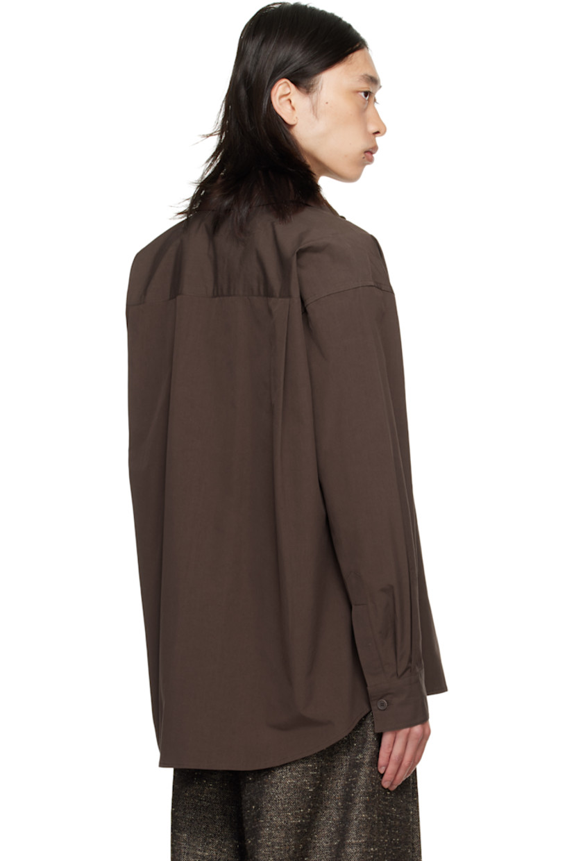 Cotton poplin shirt.

· Spread collar
· Button closure
· Patch pocket at chest
· Shirttail hem
· Buttoned barrel cuffs
· Pleats at back yoke
· Corozo hardware

Supplier color: Dark mauve