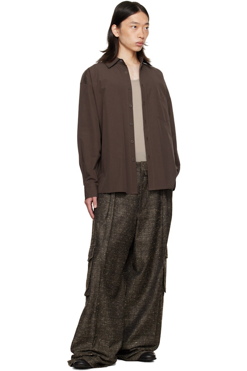 Cotton poplin shirt.

· Spread collar
· Button closure
· Patch pocket at chest
· Shirttail hem
· Buttoned barrel cuffs
· Pleats at back yoke
· Corozo hardware

Supplier color: Dark mauve