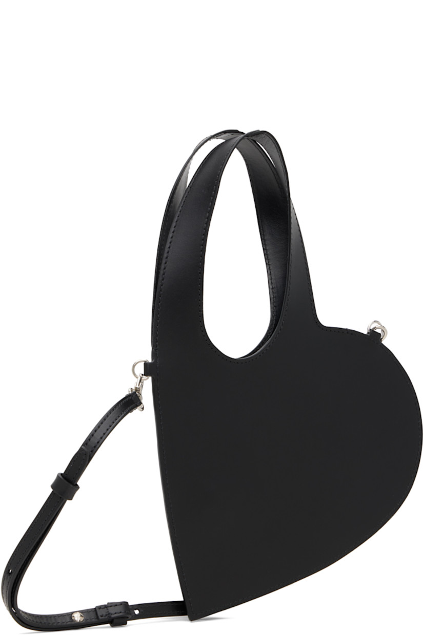 Heart-shaped buffed leather shoulder bag.

· Twin carry handles
· Detachable and adjustable crossbody strap
· Logo stamp at face
· Buffed leather lining
· H6.25" x W8"
· Total height: H12"

Supplier color: Black