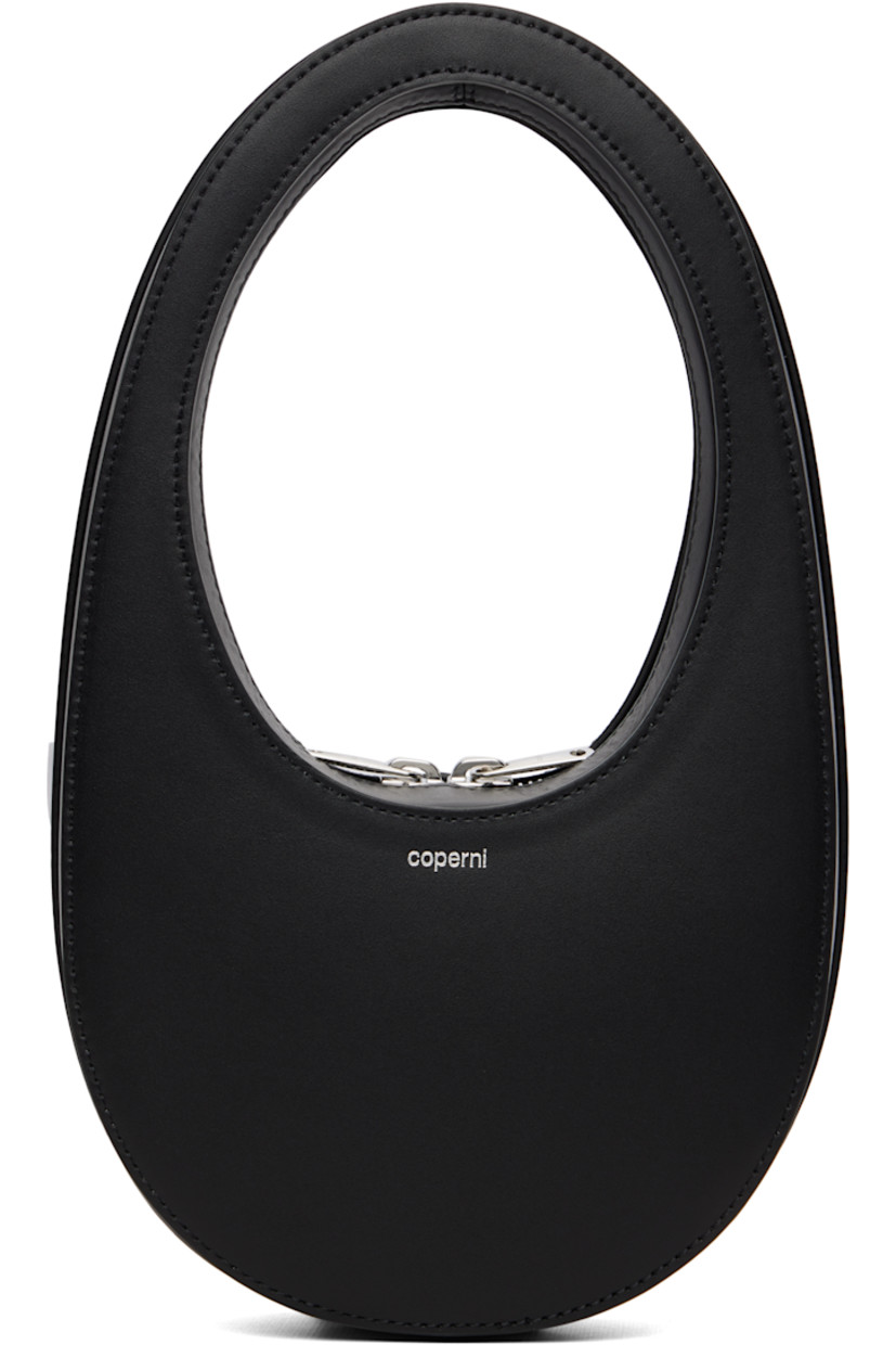 Rigid buffed leather top handle bag. 

· Integrated carry handle
· Logo stamp at face
· Logo flag at side
· Two-way zip closure
· Leather lining
· H4.25" x W6" x D2.75"
· Full height: H11"

Supplier color: Black