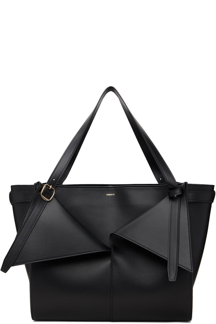 Buffed leather tote.

· Adjustable pin-buckle shoulder straps
· Detachable zip pouch at strap
· Logo stamp, foldover panels, and patch pockets at face
· Clasp fastening at throat
· Suede interior
· Gold-tone hardware
· H11" x W13" x D7"

Supplier color: Black