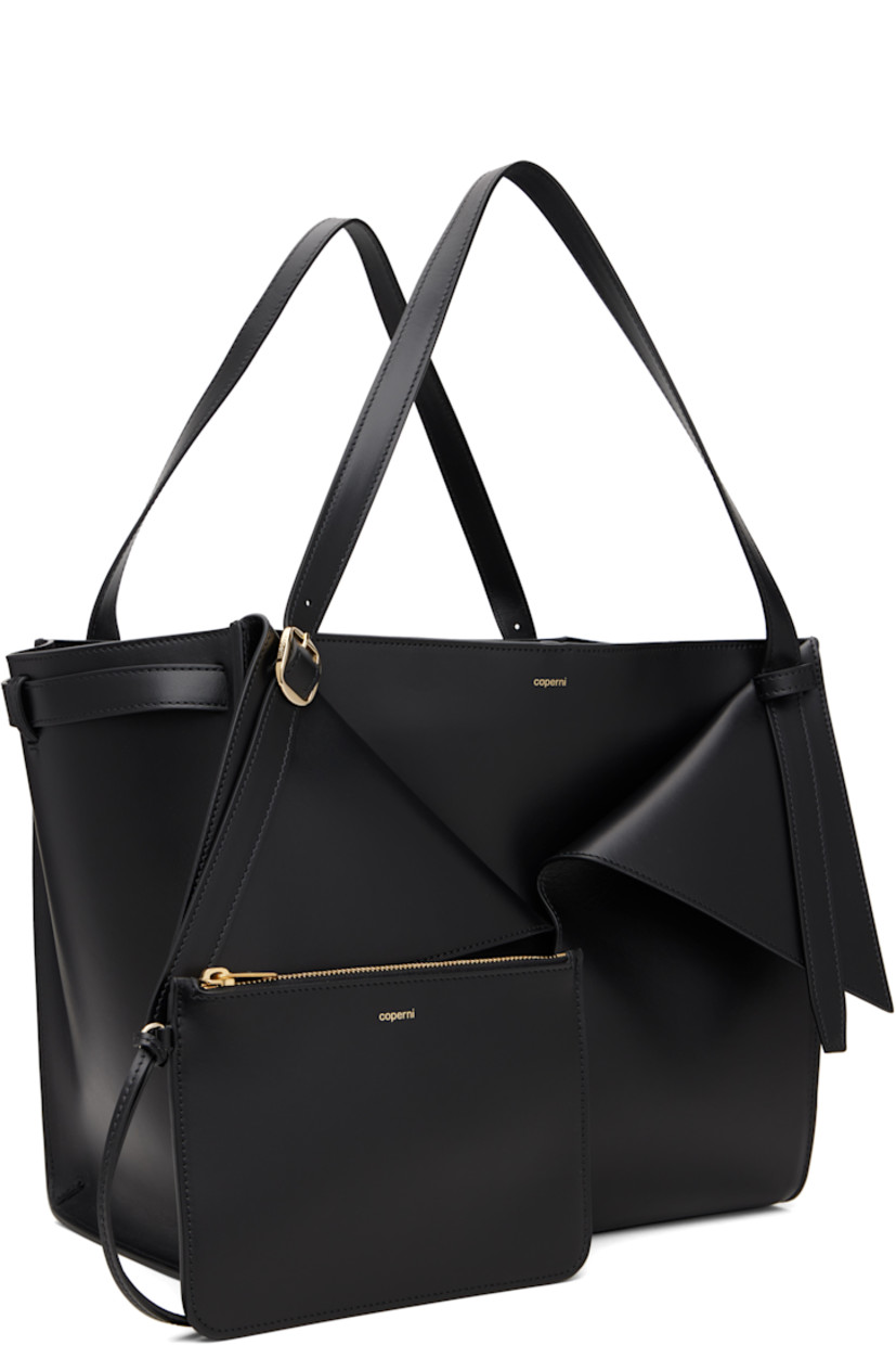 Buffed leather tote.

· Adjustable pin-buckle shoulder straps
· Detachable zip pouch at strap
· Logo stamp, foldover panels, and patch pockets at face
· Clasp fastening at throat
· Suede interior
· Gold-tone hardware
· H11" x W13" x D7"

Supplier color: Black