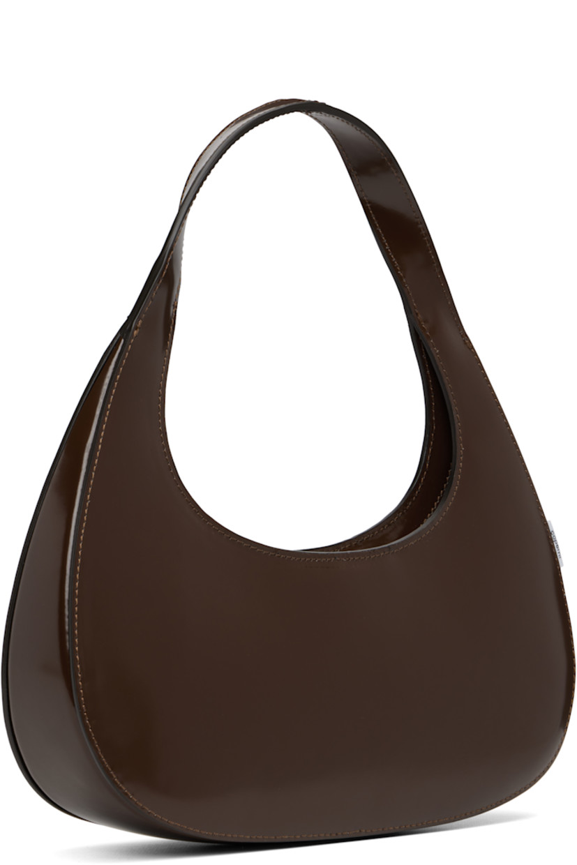 Polished leather shoulder bag.

· Integrated shoulder strap
· Logo stamp at face
· Logo flag at side
· Two-way zip closure
· Suede interior
· H4.5" x W11" x D2.25"

Supplier color: Brown