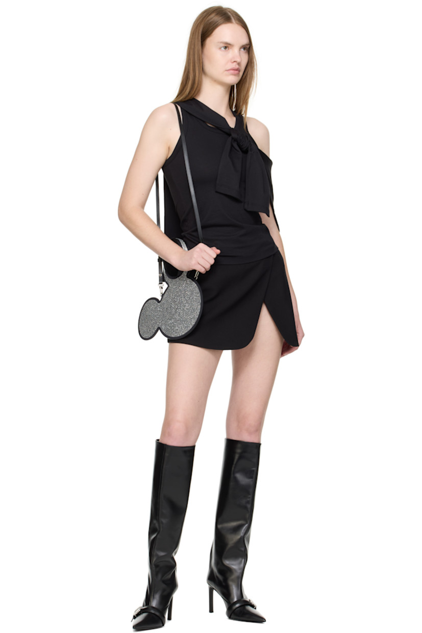 Graphic satin tote.

· Integrated carry handle 
· Adjustable and detachable leather crossbody strap
· Crystal-cut accents at face 
· Open throat
· H7.5" x W11" 
· Total height: H11.5"

Part of the Disney capsule.

Supplier color: Black/Silver