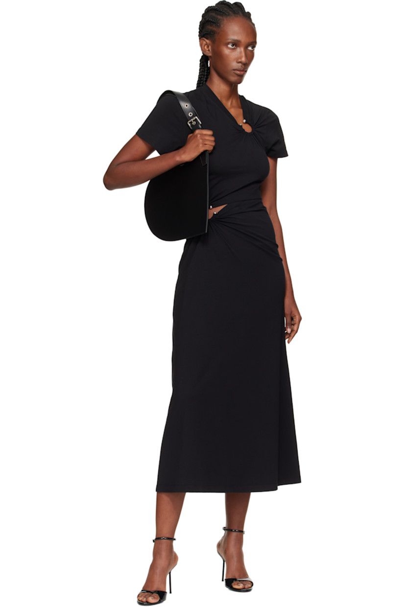 Heart-shaped buffed calfskin tote.

· Adjustable pin-buckle carry handles
· Logo stamp at face
· Buffed leather lining
· H9.75" x W13"
· Total height: H19"

Supplier color: Black