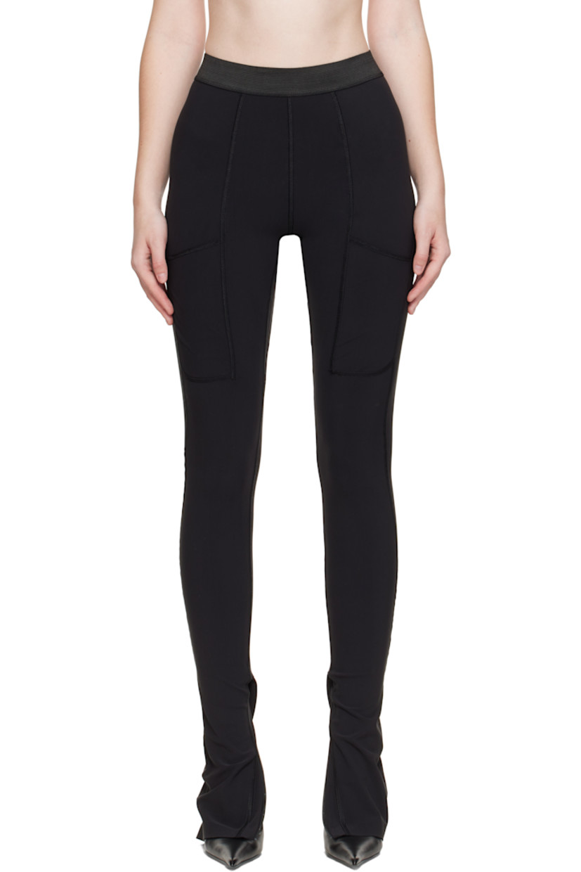 Stretch nylon jersey leggings.

· Overlock stitching throughout
· Paneled construction
· Elasticized waistband
· Patch pocket at front legs
· Zip vent at cuffs
· Logo bonded at back waist

Supplier color: Black