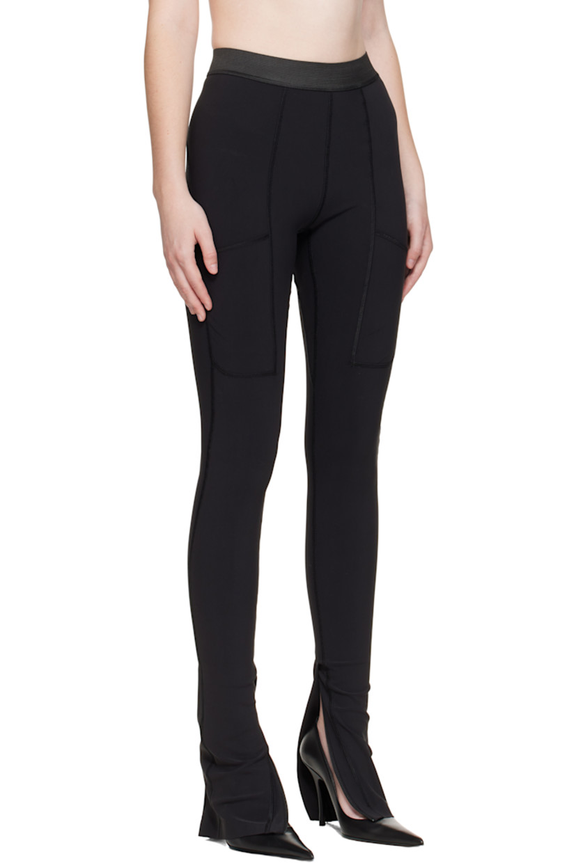 Stretch nylon jersey leggings.

· Overlock stitching throughout
· Paneled construction
· Elasticized waistband
· Patch pocket at front legs
· Zip vent at cuffs
· Logo bonded at back waist

Supplier color: Black