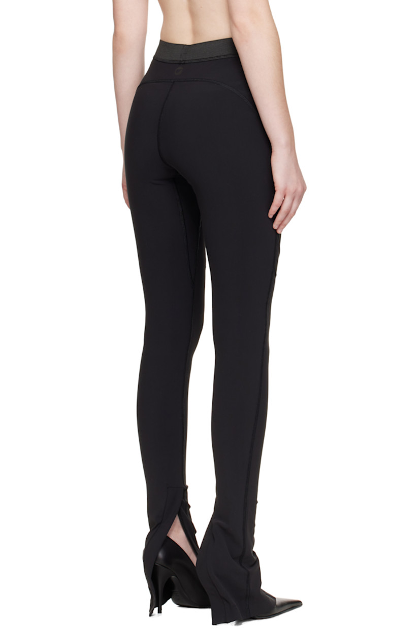 Stretch nylon jersey leggings.

· Overlock stitching throughout
· Paneled construction
· Elasticized waistband
· Patch pocket at front legs
· Zip vent at cuffs
· Logo bonded at back waist

Supplier color: Black