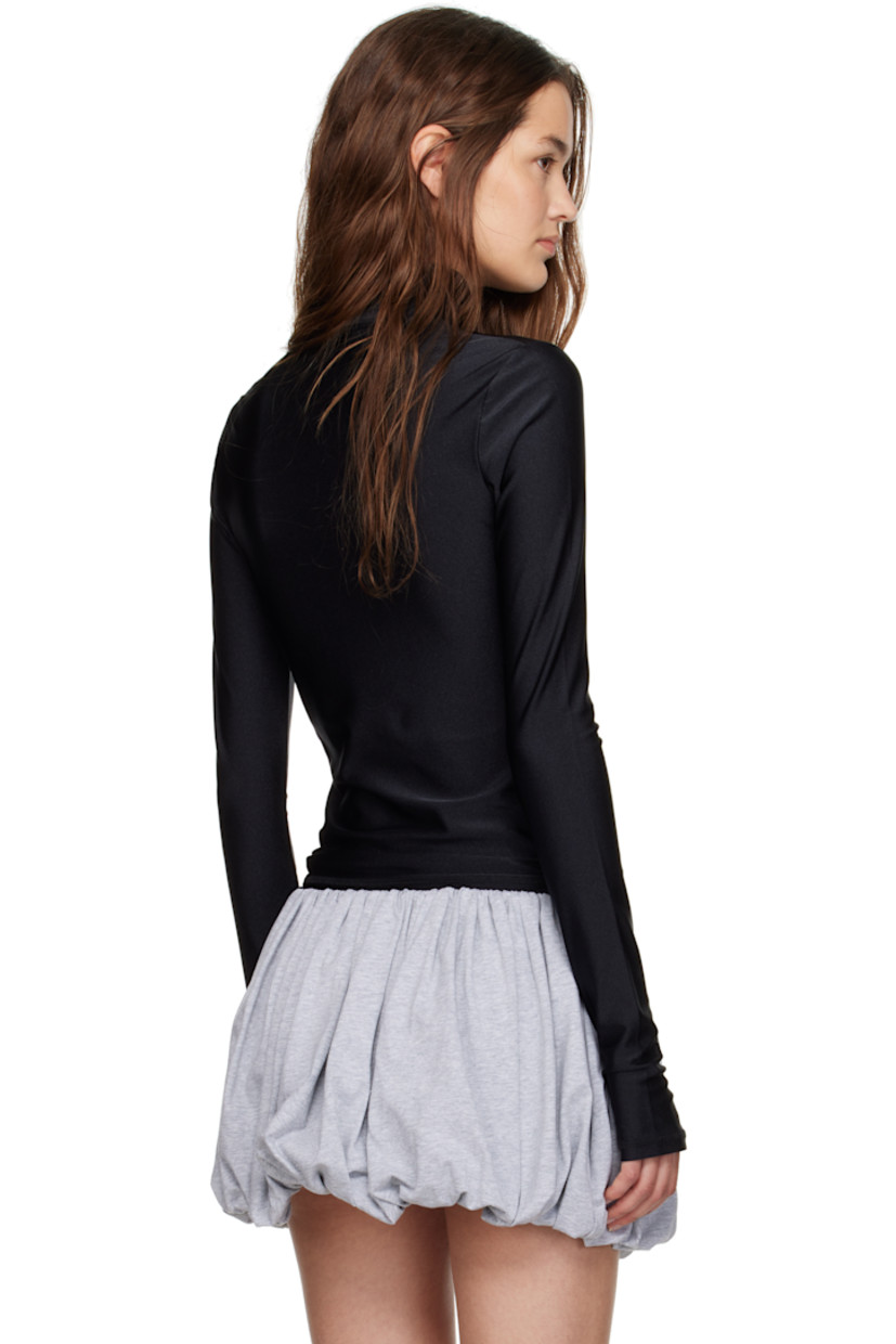 Stretch nylon jersey top.

· Mock neck
· Reflective logo printed at chest
· Thumbhole at cuffs

Supplier color: Black