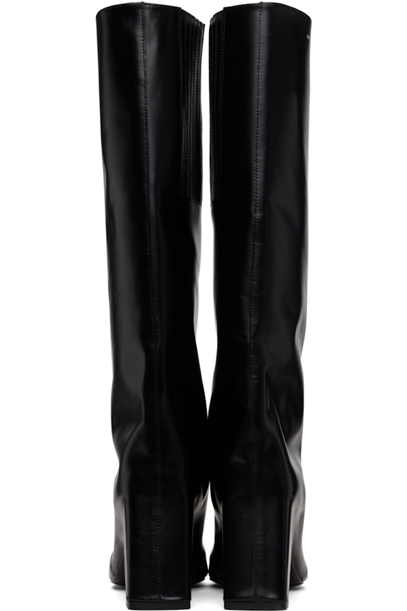 Knee-high buffed calfskin boots.

· Square toe
· Logo printed at collar
· Elasticized gusset at inner side
· Buffed leather lining
· Covered block heel with rubber injection
· Leather sole
· Heel: H3.5"

Supplier color: Black