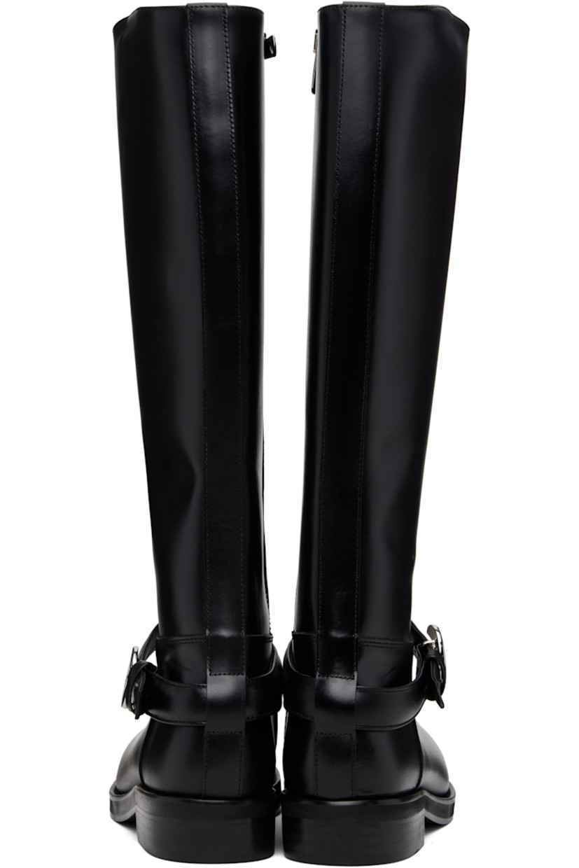 Knee-high buffed leather boots.

· Strap with logo hardware at vamp
· Zip closure at inner side
· Stacked leather block heel 
· Leather sole with rubber injections 

Supplier color: Black