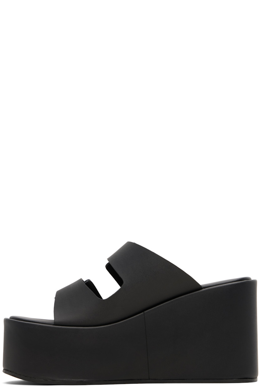 Buffed faux-leather slip-on heeled sandals.

· Open toe
· Velcro strap at vamp
· Rubberized logo patch at fixed strap
· Covered lightweight rubber platform midsole
· Rubber sole
· Platform: H2"
· Heel: H3.75"

Supplier color: Black