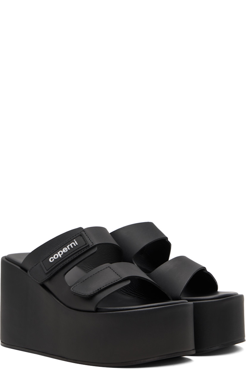 Buffed faux-leather slip-on heeled sandals.

· Open toe
· Velcro strap at vamp
· Rubberized logo patch at fixed strap
· Covered lightweight rubber platform midsole
· Rubber sole
· Platform: H2"
· Heel: H3.75"

Supplier color: Black