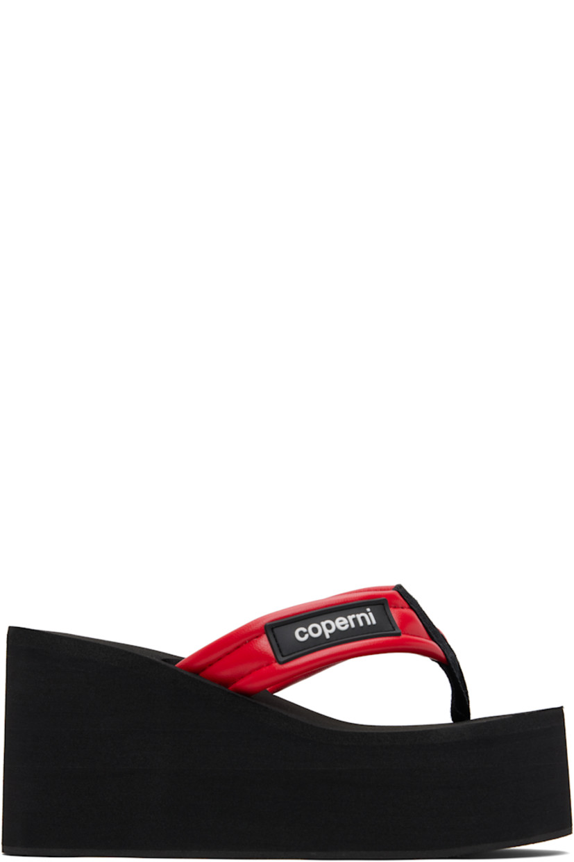 Buffed faux-leather heeled sandals.

· Thong-style strap and logo patch at vamp
· Foam rubber platform midsole
· Crêpe rubber sole
· Platform: H2"
· Heel: H3.75"

Supplier color: Black/Red