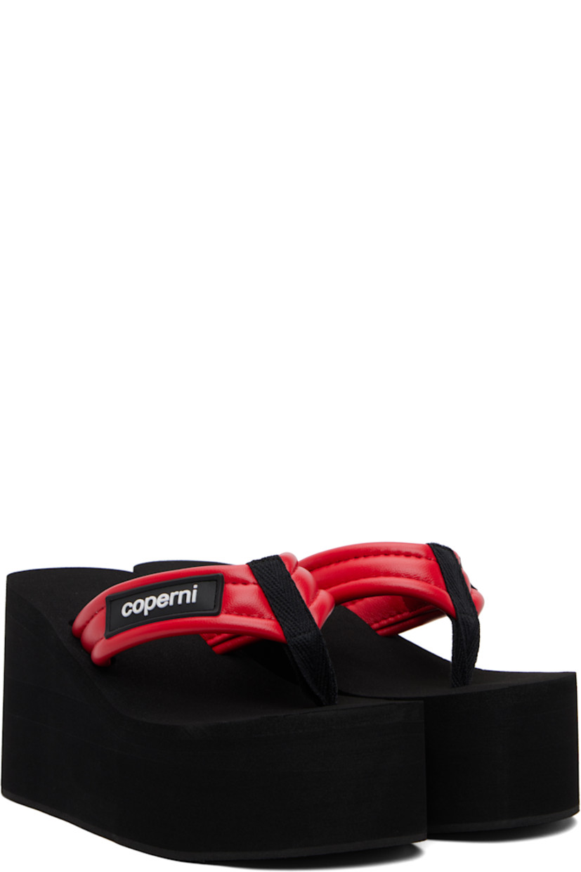 Buffed faux-leather heeled sandals.

· Thong-style strap and logo patch at vamp
· Foam rubber platform midsole
· Crêpe rubber sole
· Platform: H2"
· Heel: H3.75"

Supplier color: Black/Red
