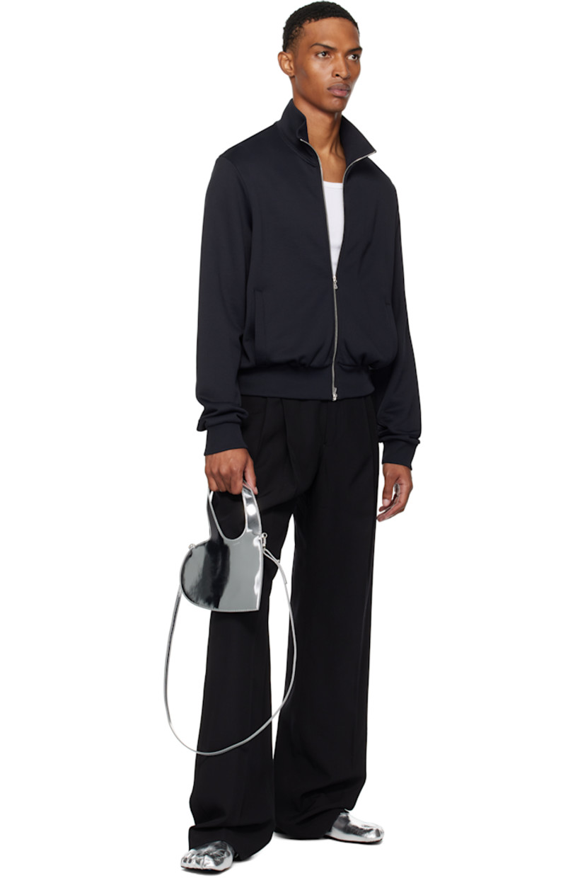 Heart-shaped patent faux-leather messenger bag.

· Integrated carry handles
· Adjustable and detachable crossbody strap
· H8.5" x W9"
· Total height: H13"

Supplier color: Silver
