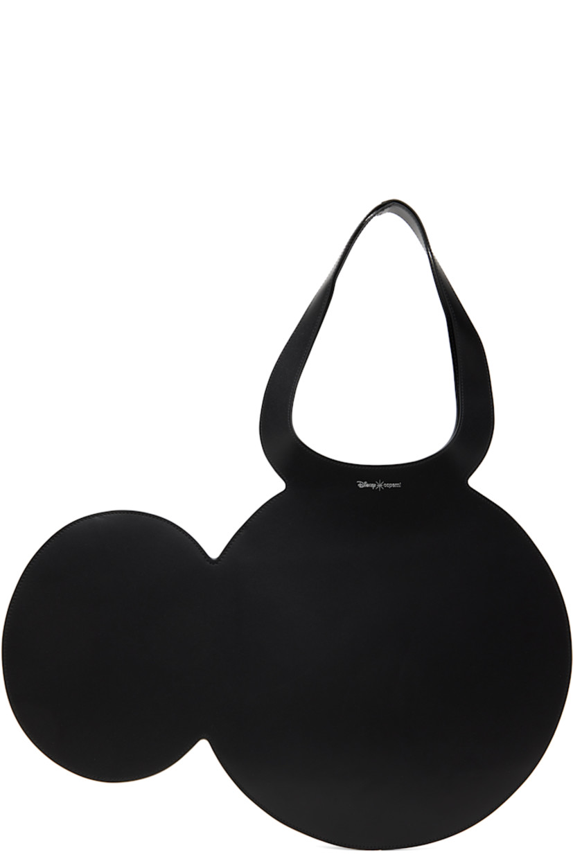 Graphic buffed calfskin tote in black.

· Twin carry handles
· Silver-tone logo stamp at face 
· Open throat
· H13.5" x W19.75"
· Total height: H21"

Part of the Disney capsule.

Supplier color: Black