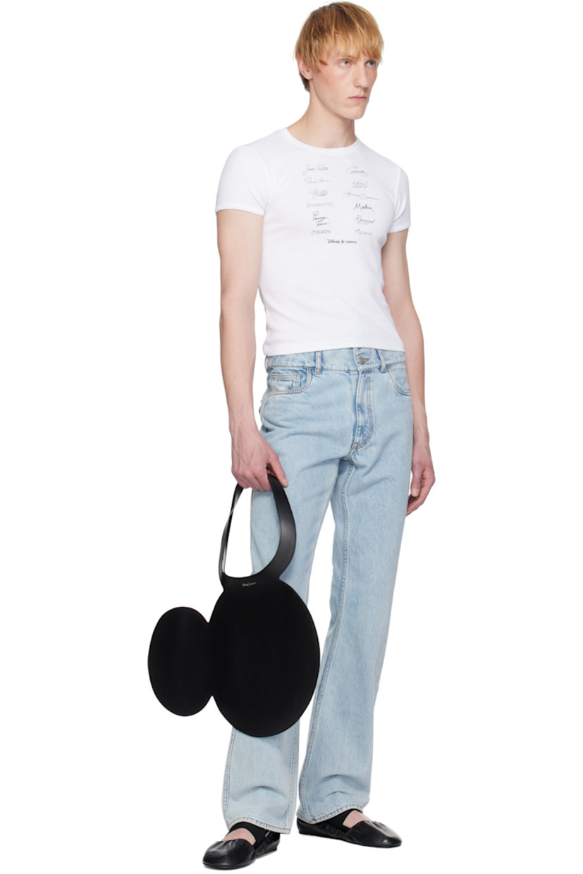 Graphic buffed calfskin tote in black.

· Twin carry handles
· Silver-tone logo stamp at face 
· Open throat
· H13.5" x W19.75"
· Total height: H21"

Part of the Disney capsule.

Supplier color: Black