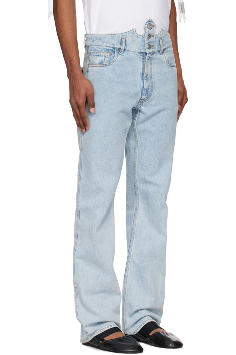 Non-stretch organic cotton denim jeans. Fading throughout.

· Belt loops and button fastening at modified waistband
· Five-pocket styling
· Zip fly
· Post-stud strap with logo hardware at back pocket
· Contrast stitching in tan

Part of the Disney capsule.

Supplier color: Blue bleached