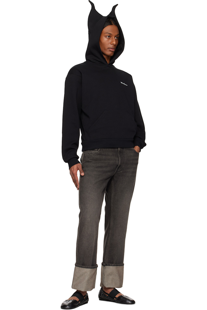 Organic cotton-blend fleece hoodie.

· Graphic appliqués at hood
· Logo printed at chest
· Rib-knit hem and cuffs
· Dropped shoulders

Part of the Disney capsule.

Supplier color: Black