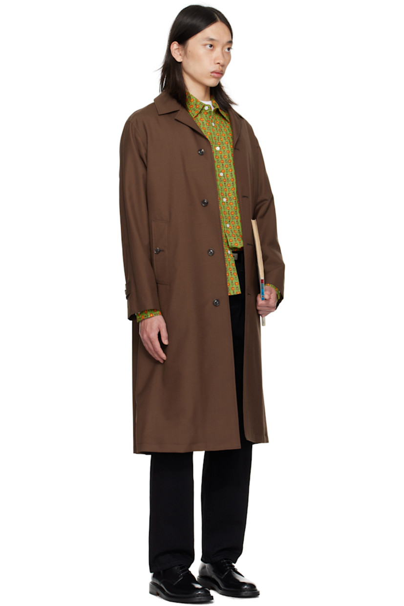 Wool- and mohair-blend delaine coat.

· Open spread collar
· Button closure
· Welt pockets at front
· Adjustable button tab at cuffs
· Central vent at back hem
· Welt pockets at interior
· Full twill and satin lining

Supplier color: Brown