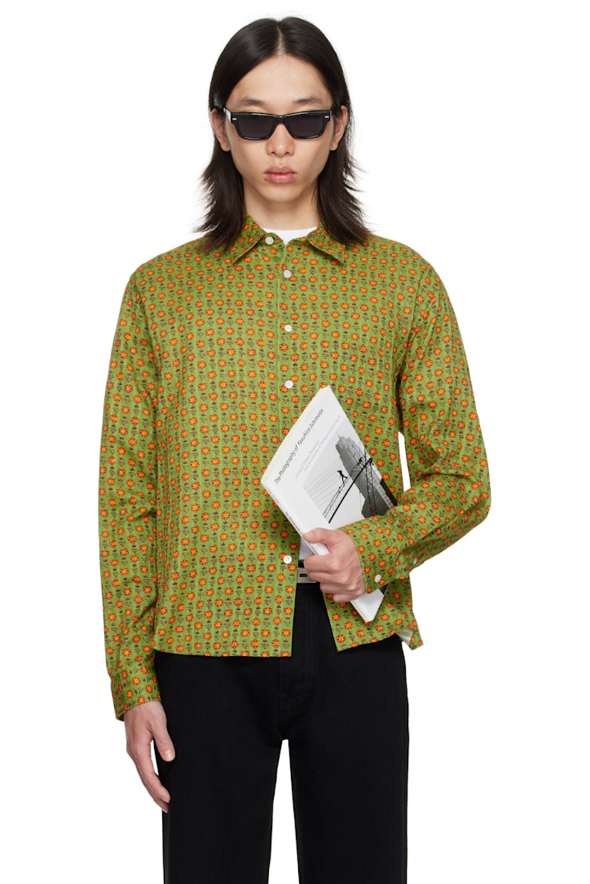 Cotton dobby cloth shirt.

· Floral pattern printed throughout
· Spread collar
· Button closure
· Patch pocket at chest
· Shirttail hem
· Adjustable buttoned barrel cuffs
· Pleats at back yoke

Supplier color: Green