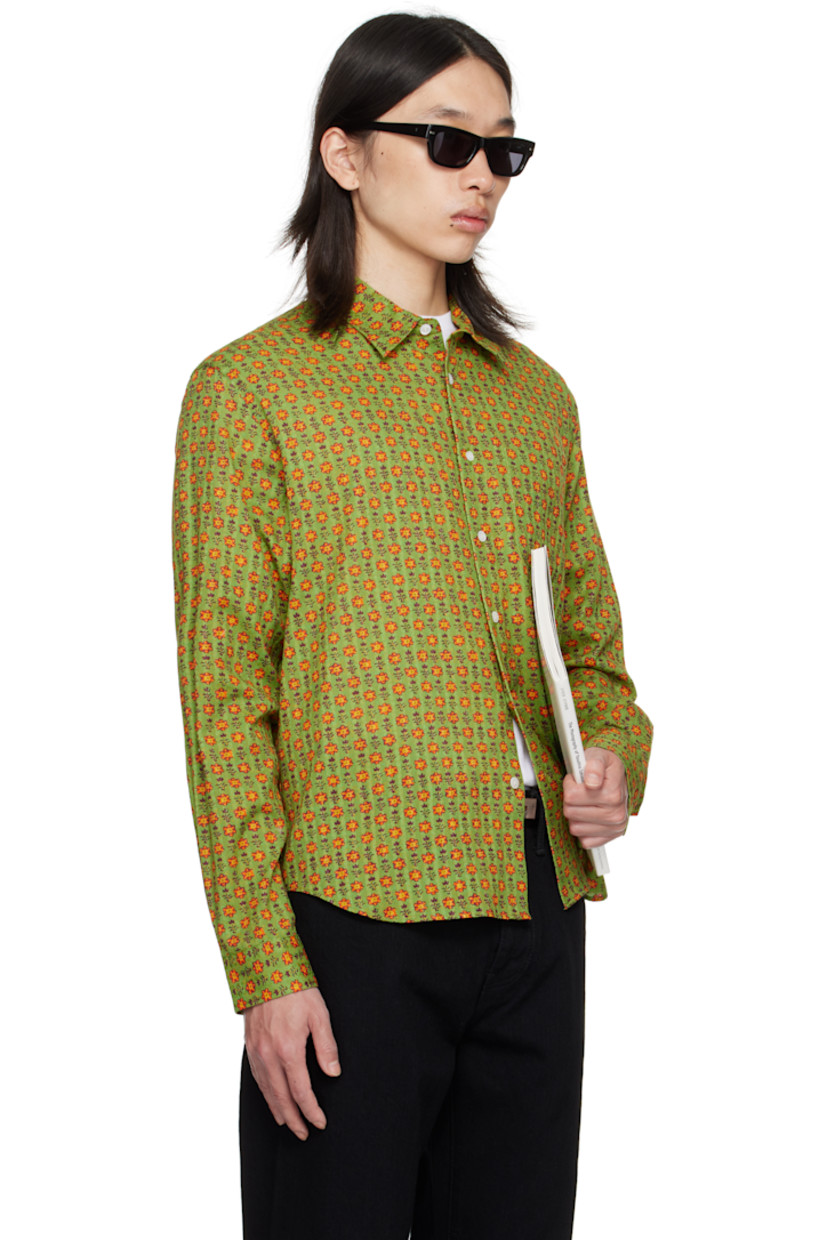 Cotton dobby cloth shirt.

· Floral pattern printed throughout
· Spread collar
· Button closure
· Patch pocket at chest
· Shirttail hem
· Adjustable buttoned barrel cuffs
· Pleats at back yoke

Supplier color: Green