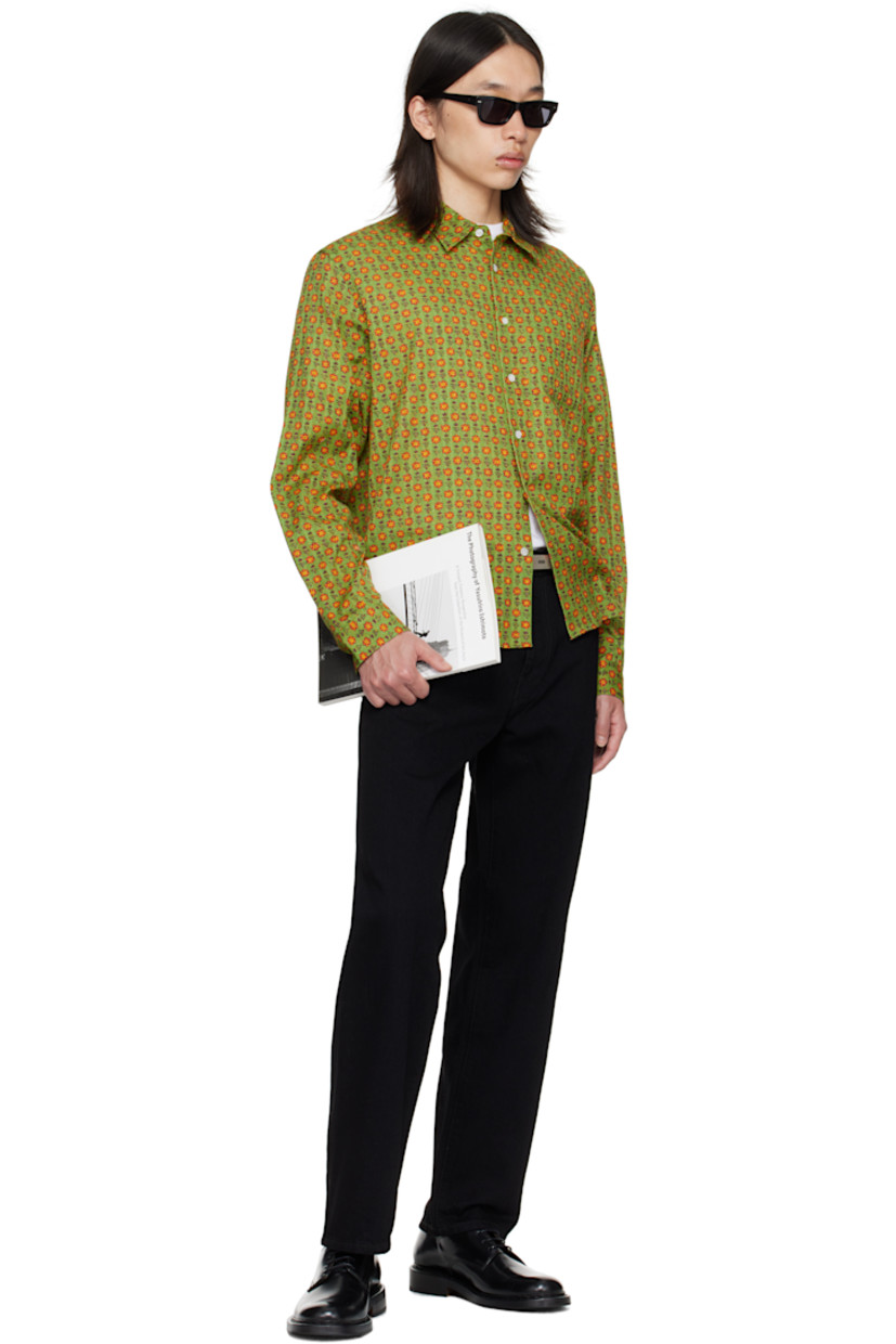 Cotton dobby cloth shirt.

· Floral pattern printed throughout
· Spread collar
· Button closure
· Patch pocket at chest
· Shirttail hem
· Adjustable buttoned barrel cuffs
· Pleats at back yoke

Supplier color: Green