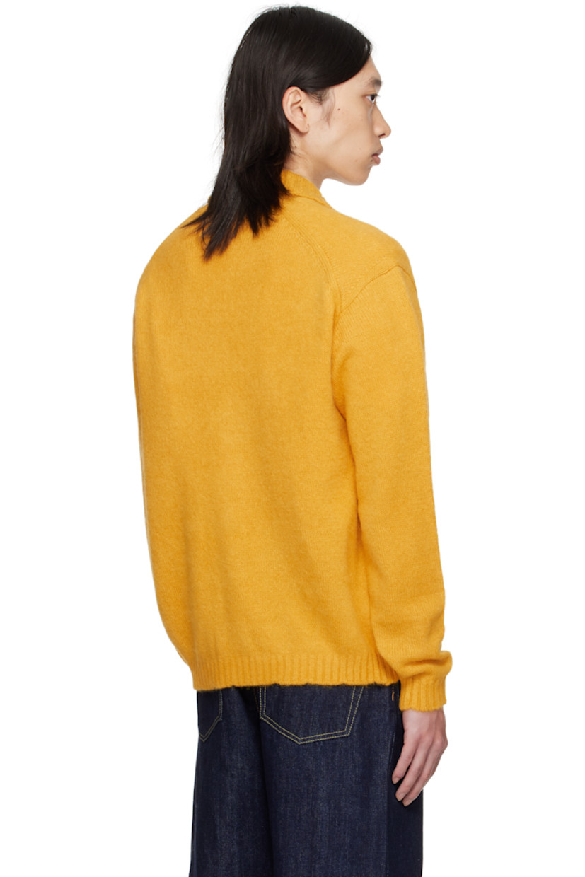 Knit alpaca-blend cardigan.

· Rib-knit spread collar, placket, hem, and cuffs
· Button closure
· Welt pockets at front
· Dropped shoulders

Supplier color: Marigold