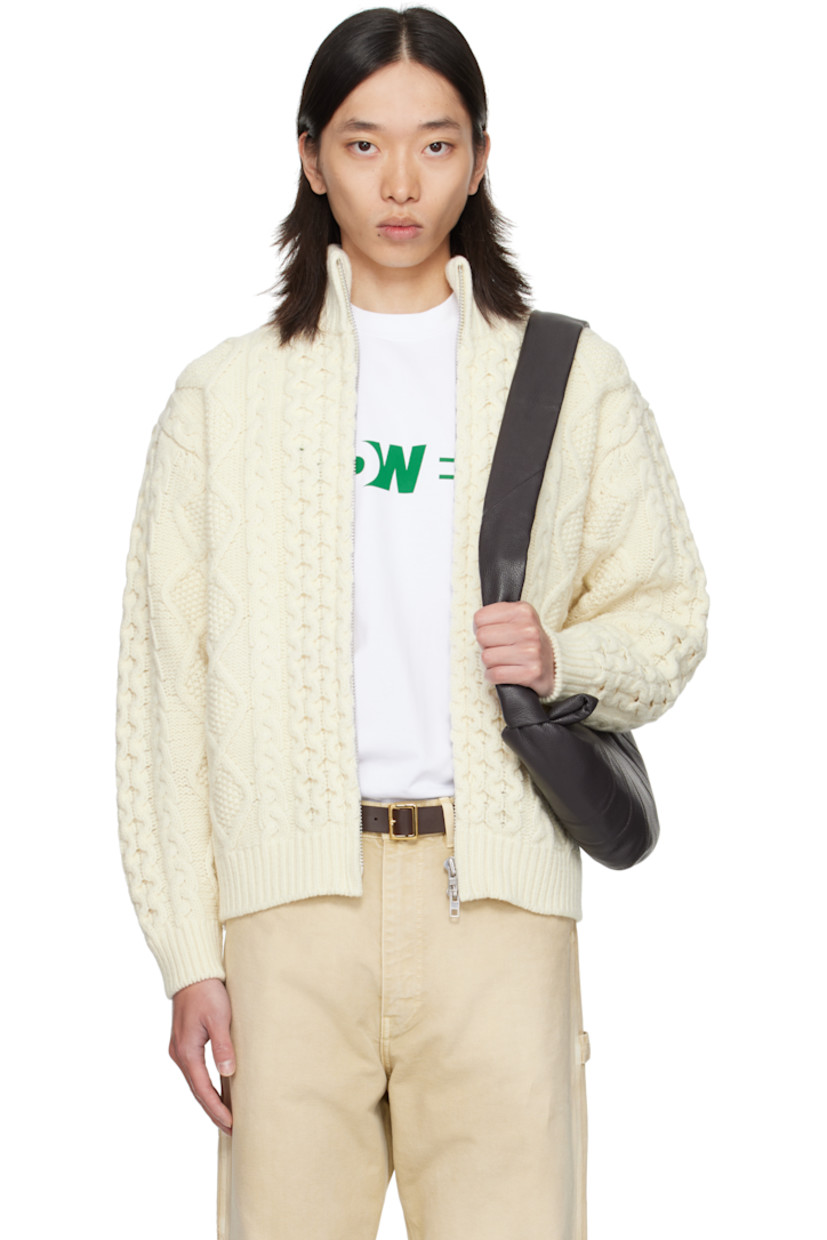 Cable-knit wool sweater.

· Rib-knit stand collar, hem, and cuffs
· Two-way zip closure
·� Seam pockets at waist
· Dropped shoulders

Supplier color: Cream
