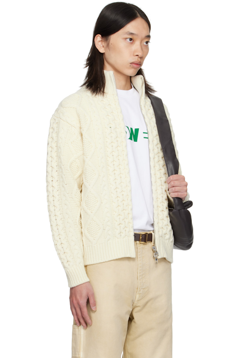 Cable-knit wool sweater.

· Rib-knit stand collar, hem, and cuffs
· Two-way zip closure
· Seam pockets at waist
· Dropped shoulders

Supplier color: Cream