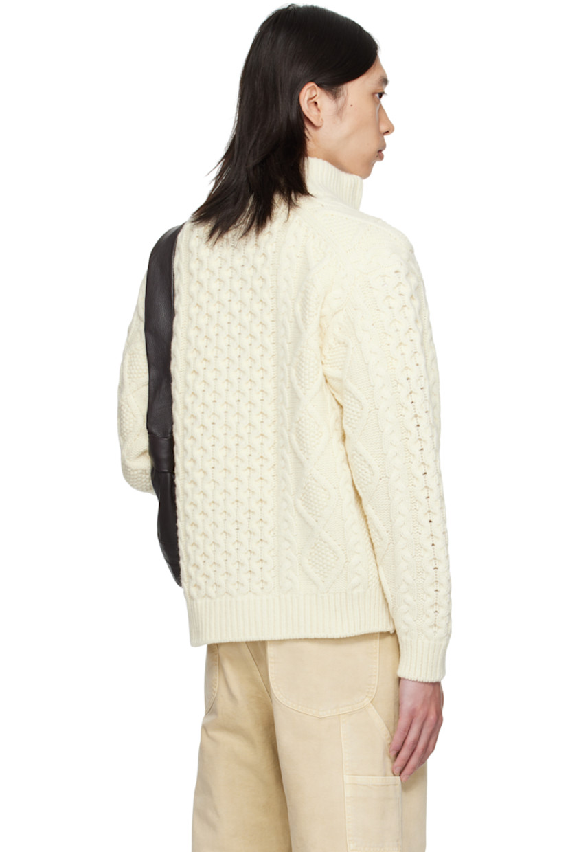 Cable-knit wool sweater.

· Rib-knit stand collar, hem, and cuffs
· Two-way zip closure
· Seam pockets at waist
· Dropped shoulders

Supplier color: Cream