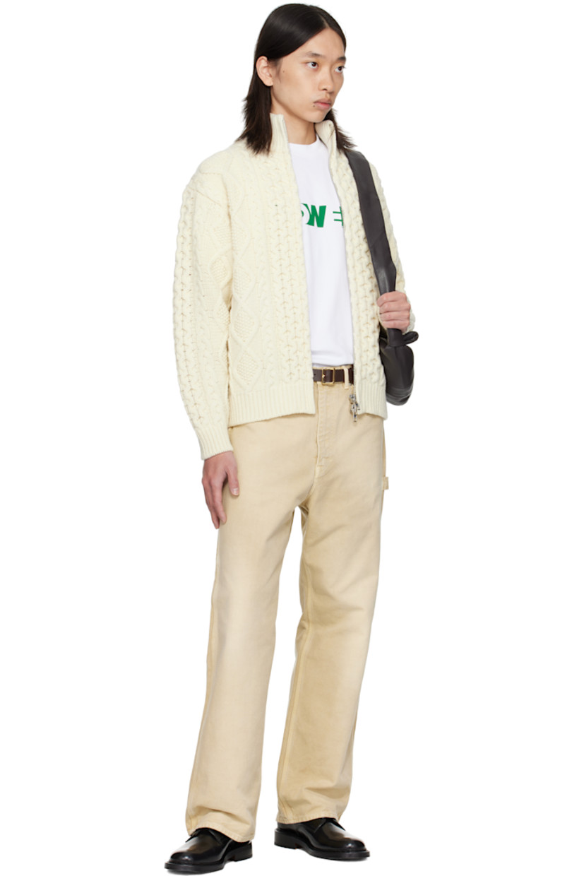 Cable-knit wool sweater.

· Rib-knit stand collar, hem, and cuffs
· Two-way zip closure
· Seam pockets at waist
· Dropped shoulders

Supplier color: Cream