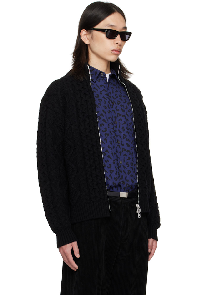 Cable-knit wool sweater.

· Rib-knit stand collar, hem, and cuffs
· Two-way zip closure
· Seam pockets at waist
· Dropped shoulders

Supplier color: Black