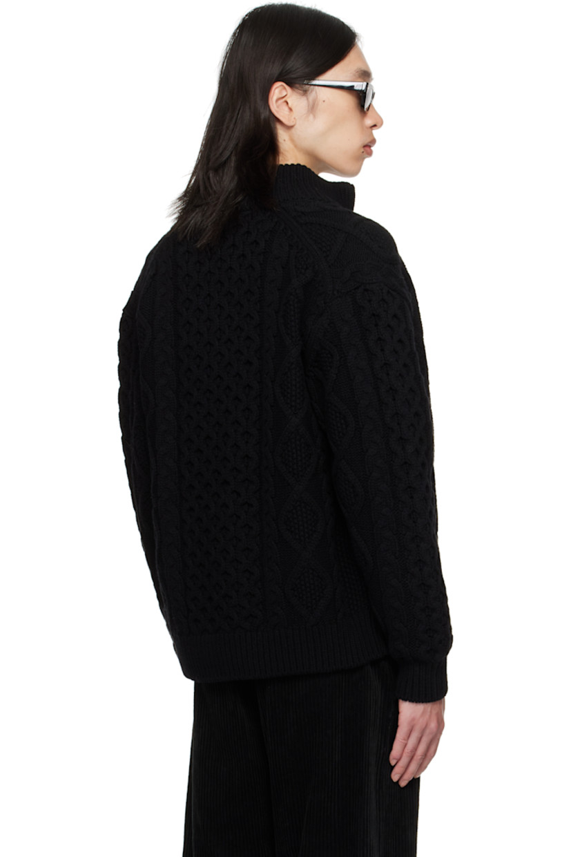 Cable-knit wool sweater.

· Rib-knit stand collar, hem, and cuffs
· Two-way zip closure
· Seam pockets at waist
· Dropped shoulders

Supplier color: Black