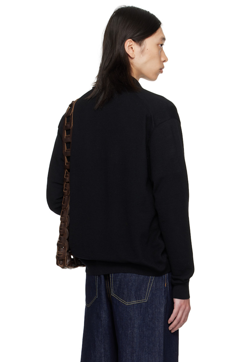 Knit wool polo.

· Rib-knit spread collar, hem, and cuffs
· Two-button placket
· Dropped shoulders

Supplier color: Black