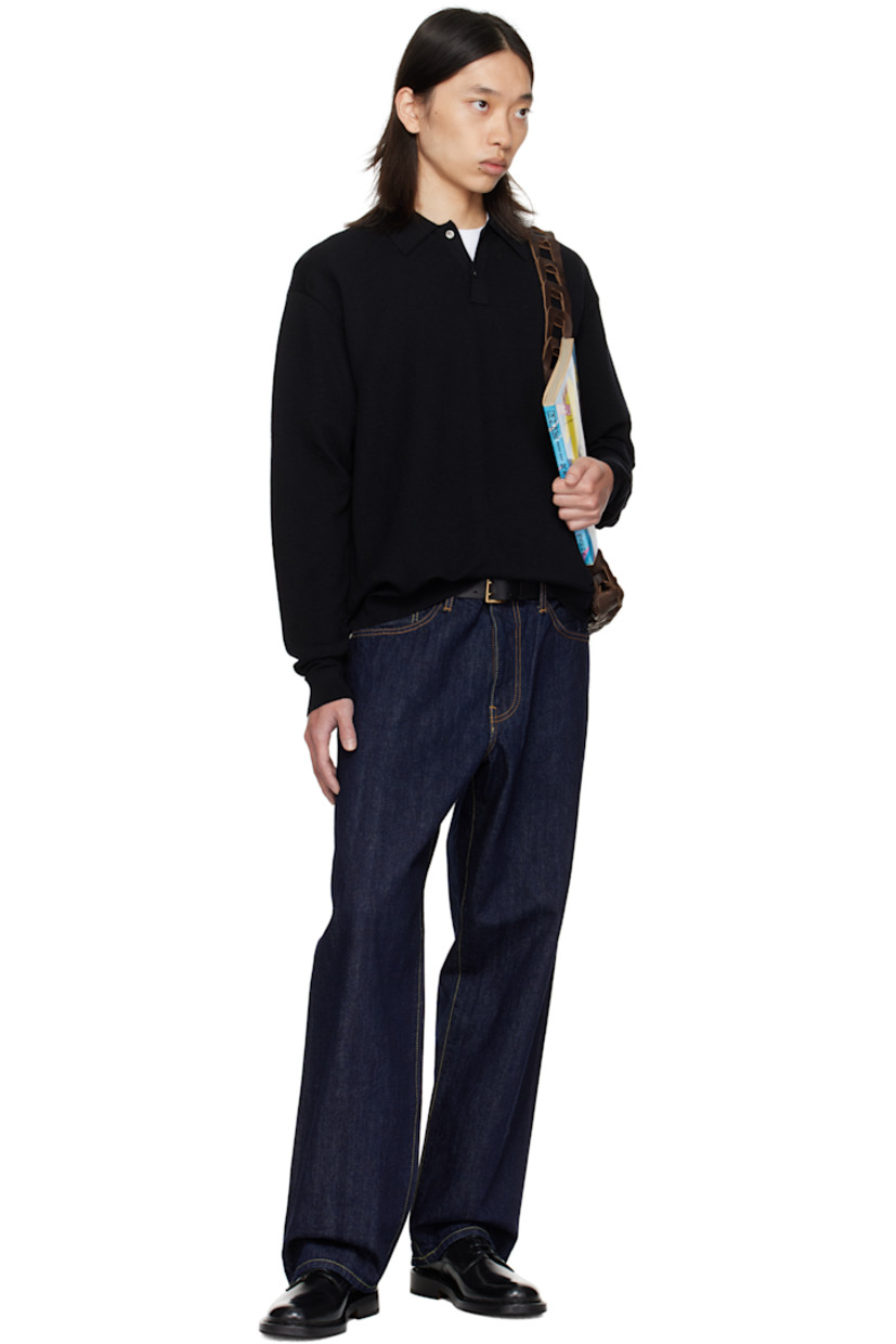 Knit wool polo.

· Rib-knit spread collar, hem, and cuffs
· Two-button placket
· Dropped shoulders

Supplier color: Black