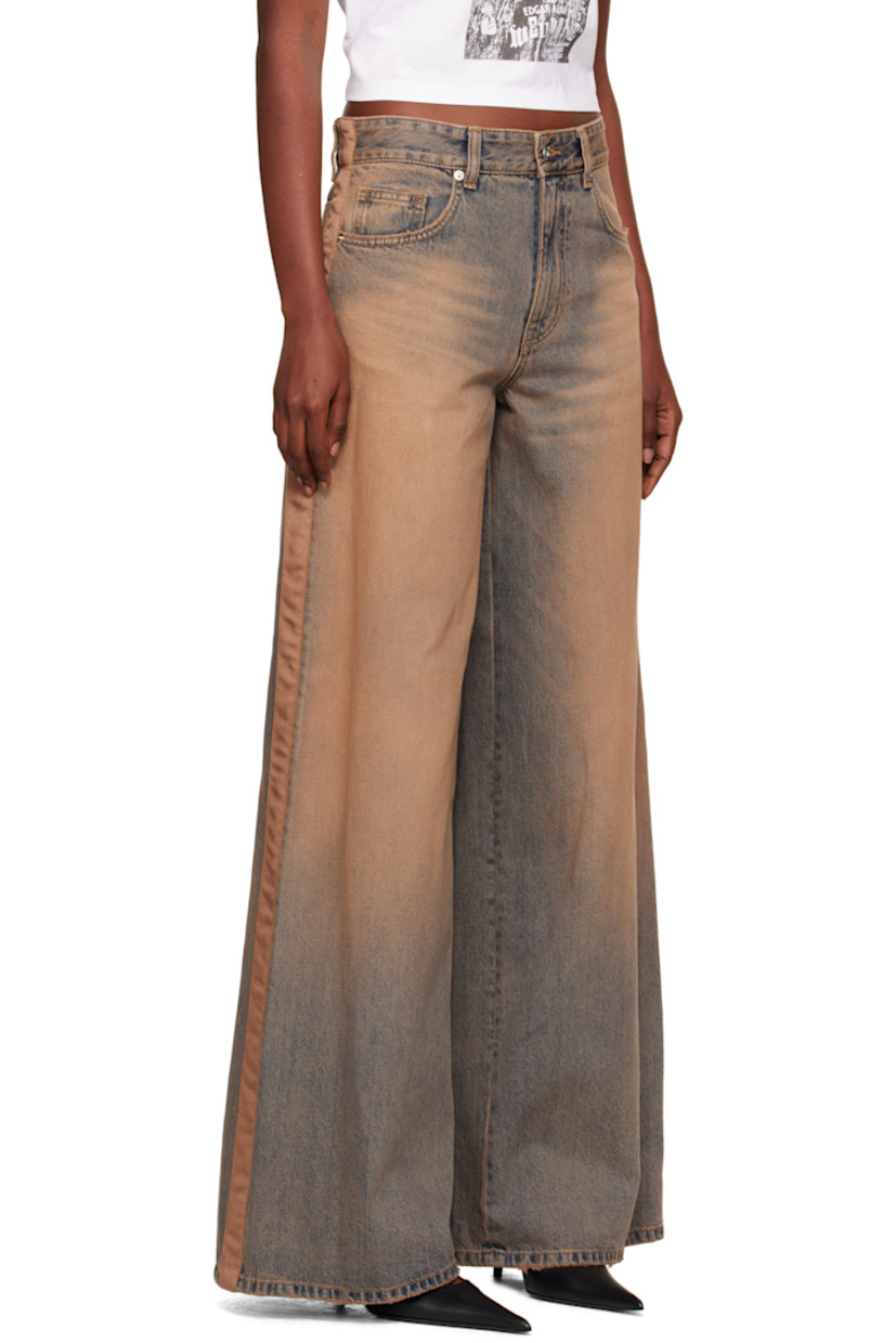 Non-stretch denim jeans.

· Discoloration, whiskering, and subtle distressing throughout
· Wide-leg
· Mid-rise
· Belt loops
· Five-pocket styling
· Zip fly
· Grosgrain trim at outseams
· Jacron logo patch at back waistband
· Logo embroidered at back pocket

Supplier color: Beige