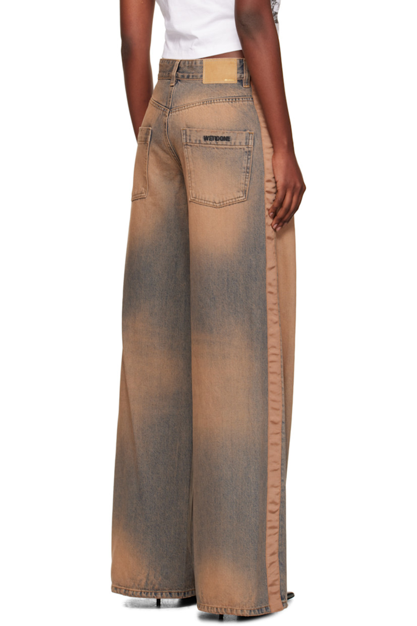 Non-stretch denim jeans.

· Discoloration, whiskering, and subtle distressing throughout
· Wide-leg
· Mid-rise
· Belt loops
· Five-pocket styling
· Zip fly
· Grosgrain trim at outseams
· Jacron logo patch at back waistband
· Logo embroidered at back pocket

Supplier color: Beige