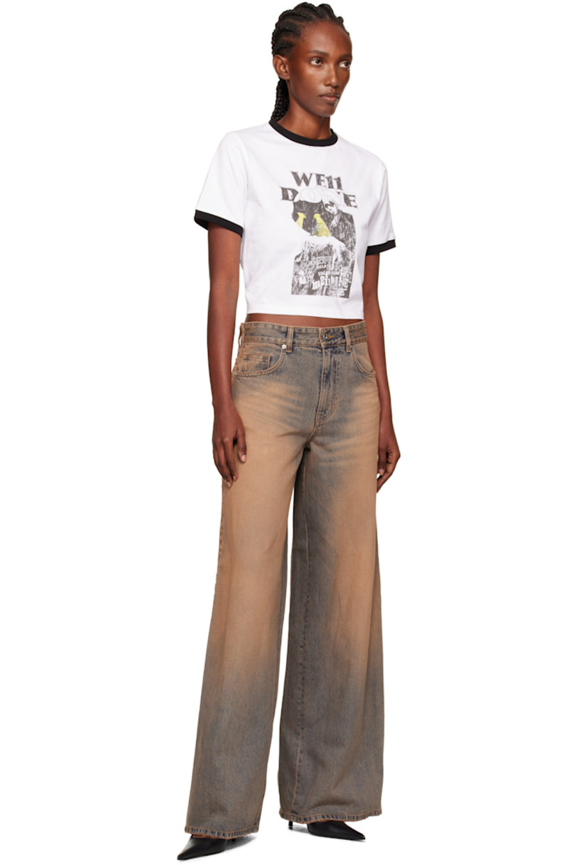 Non-stretch denim jeans.

· Discoloration, whiskering, and subtle distressing throughout
· Wide-leg
· Mid-rise
· Belt loops
· Five-pocket styling
· Zip fly
· Grosgrain trim at outseams
· Jacron logo patch at back waistband
· Logo embroidered at back pocket

Supplier color: Beige
