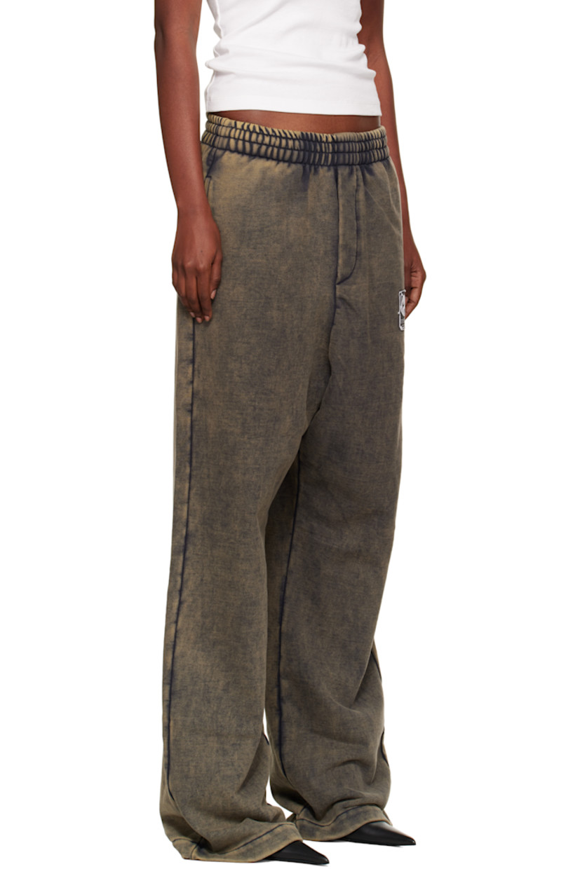 Cotton French terry sweatpants.

· Fading and discoloration throughout
· Concealed drawstring at elasticized waistband
· Three-pocket styling
· Mock fly
· Logo graphic patch at front

Supplier color: Charcoal